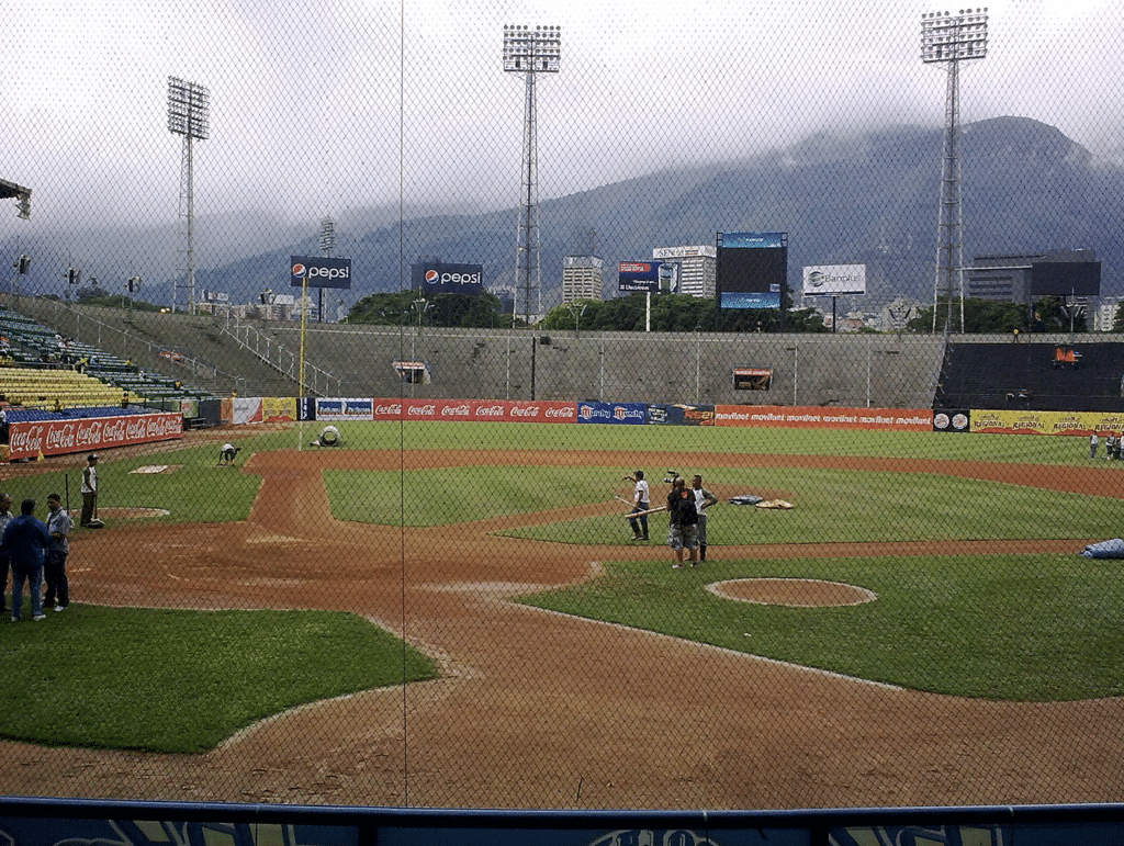 Estadio Universitario as seen from home plate. The rolling mountains behind outfield and fantastic outfield bleachers make this a great stadium to catch a game. Photo Source: Wikimedia Commons