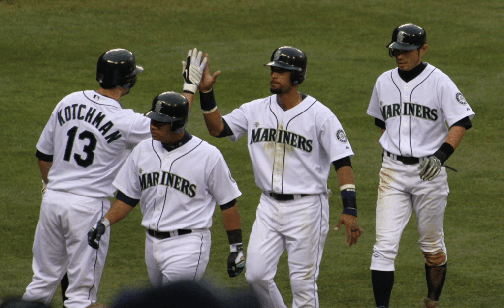 López (second from left) walks to the dugout in Seattle, along with Franklin Gutiérrez (second from right) and Ichiro Suzuki (right). Ichiro and López played on the same team from 2004-2010, and are now two of three players to ever hit for 1000 hits in both NPB and MLB. Photo taken from Wikimedia Commons