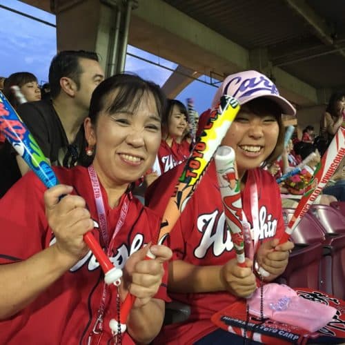 Energetic fans constantly slam together their thundersticks throughout the game.