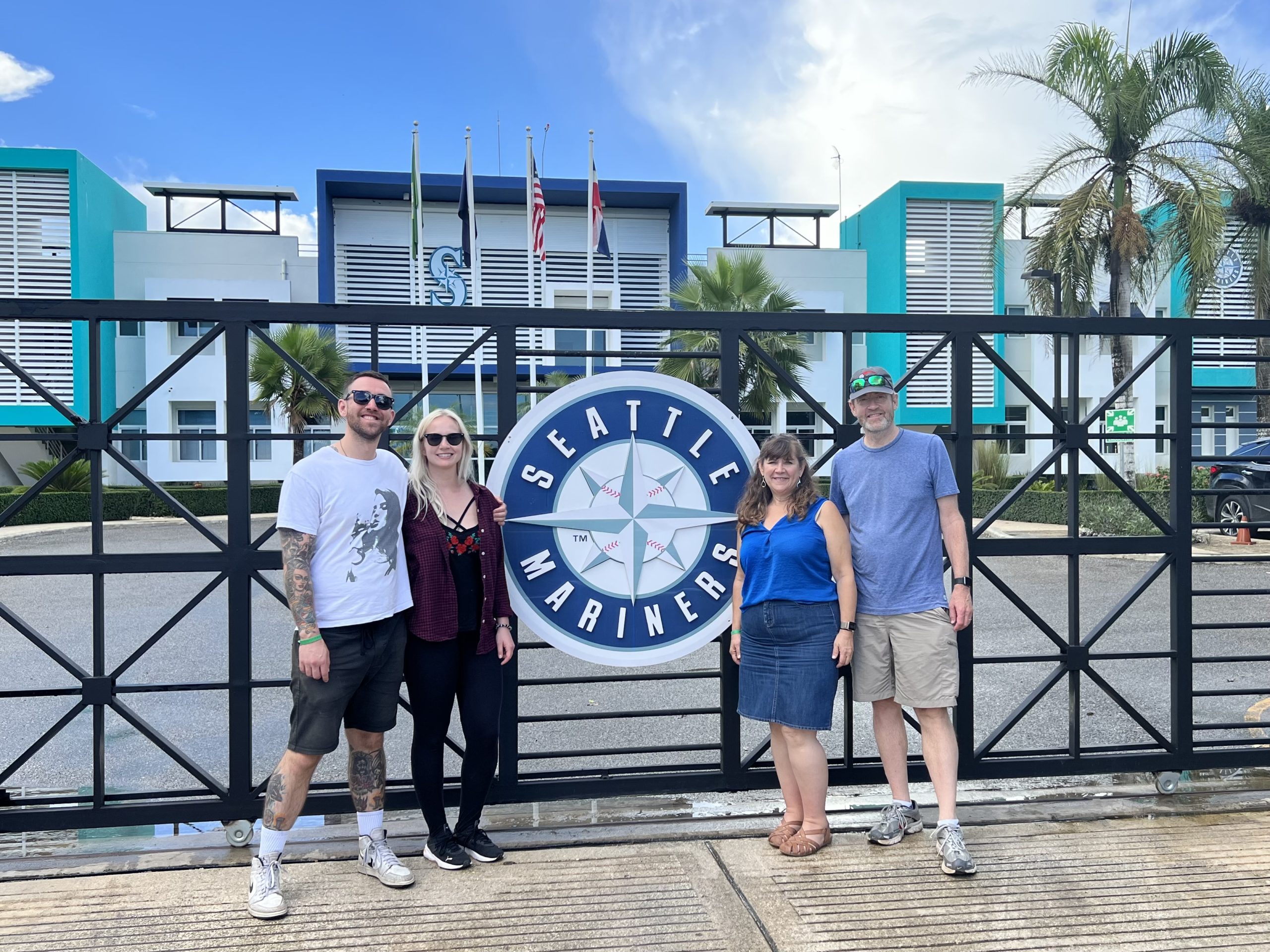 Matt, Erin, Rob, and Beth in front of the Dominican academy of their favorite team, the Seattle Mariners.