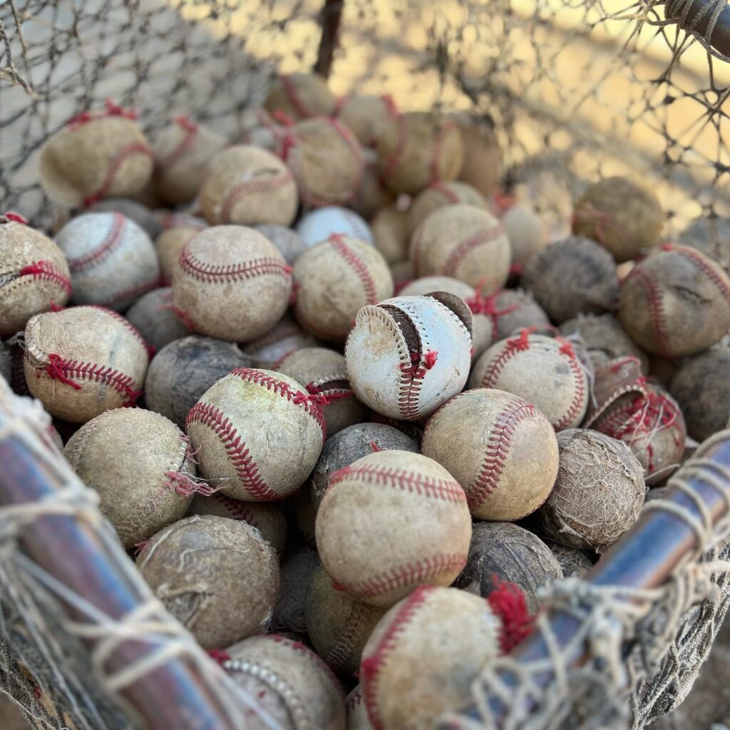 A pile of old baseballs.